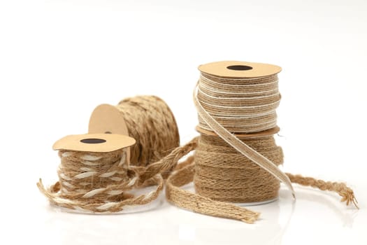 Rolls of braided cord of sackcloth and hemp for decoration and decoration. Selective focus with shallow depth of field.