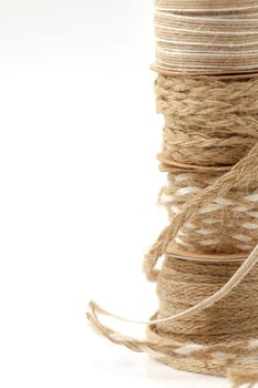Rolls of braided cord of sackcloth and hemp for decoration and decoration. Selective focus with shallow depth of field.