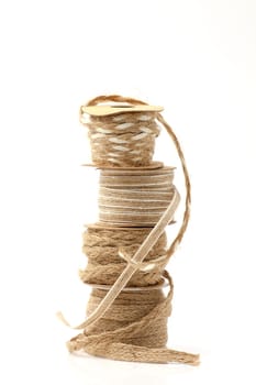 Rolls of braided cord of sackcloth and hemp for decoration and decoration. Selective focus with shallow depth of field.