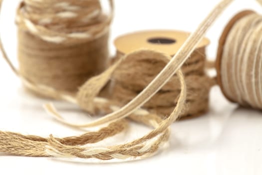 Rolls of braided cord of sackcloth and hemp for decoration and decoration. Selective focus with shallow depth of field.