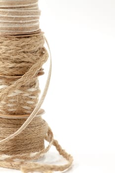 Rolls of braided cord of sackcloth and hemp for decoration and decoration. Selective focus with shallow depth of field.