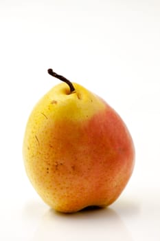 Fruit fresh pear with an imperfect shape. Selective focus with shallow depth of field.