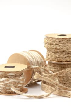 Rolls of braided cord of sackcloth and hemp for decoration and decoration. Selective focus with shallow depth of field.