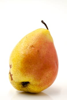 Fruit fresh pear with an imperfect shape. Selective focus with shallow depth of field.