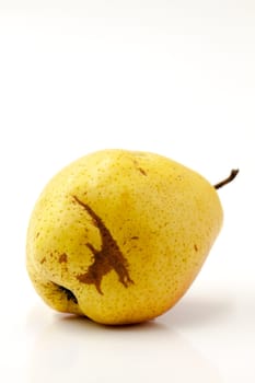 Fruit fresh pear with an imperfect shape. Selective focus with shallow depth of field.