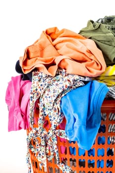 Red plastic laundry basket full of colorful clothes