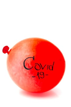 COVID - 19 red bubble balloon, a global problem for the size of a pandemic. Selective focus with shallow depth of field.