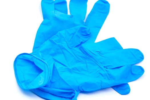 Pair of safety blue latex gloves for hygiene purposes. Selective focus with shallow depth of field.