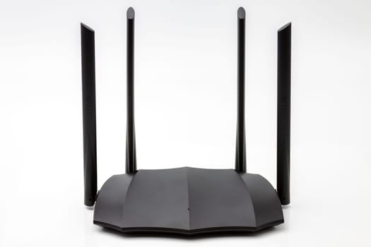 Home dual band gigabit wifi router transmitting high speed internet.Selective focus with shallow depth of field.