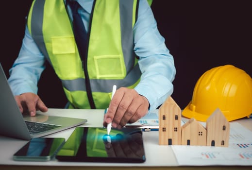 Project presentation plan, Architect or engineer using tablet to work on table, Cost calculation, construction planning, Structural calculation, Construction cost planning, structural design.