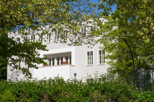 Modern, white residential building in spring, Hamburg, Germany