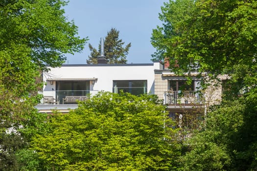 Modern, white residential building in spring, Hamburg, Germany