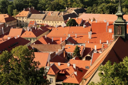View from the Petrovaradin Upper Fortress onto the roofs of the buildings in the Patrovaradin Lower Fortress, the bell tower of the Church of Saint George, Juraj on the right, Novi Sad, Serbia 2022