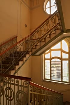 Stairwell, staircase inside the Menraths, Menrats Palace with elaborate handrails and stained glass windows, an example of Art Nouveau architecture in the city center, old town of Novi Sad, Serbia 2022