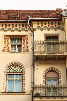 Facade and two balconies of the Savings Bank Palace building, an example of Art Nouveau architecture in the city center of Subotica, Serbia 2022