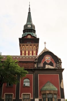 The facade and clock tower of the city hall, town hall of Subotica, an example of Art Nouveau architecture in the city center, Subotica, Serbia 2022
