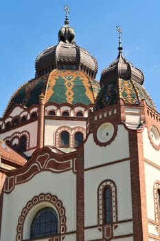 Upper facade and two domes, cupolas, the central dome and one side dome of the Synagogue of Subotica, Serbia 2022