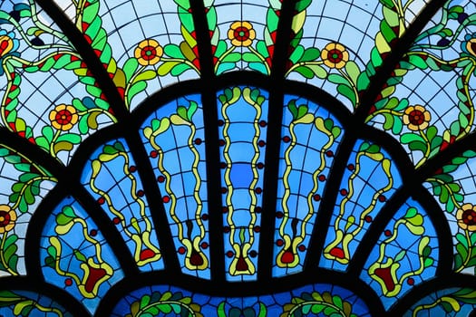 Close look on a stained glass window in different shades of blue inside the Synagogue of Subotica, second floor, Subotica, Serbia 2022