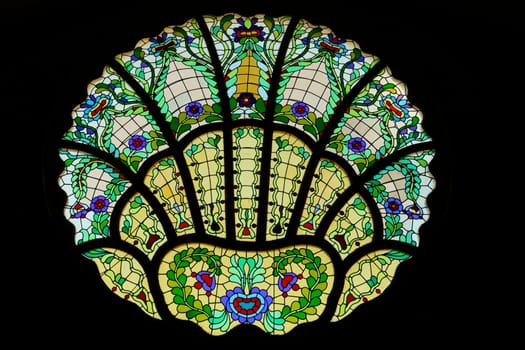 Stained glass window in different shades of green inside the Synagogue of Subotica, second floor, Subotica, Serbia 2022