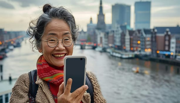 Happy Asian woman using mobile phone making a video call or taking selfie during travel enjoy urban outdoor lifestyle travel city street on holiday vacation.