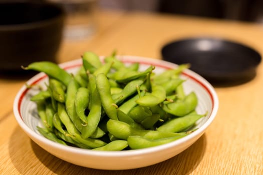 Fresh steamed edamame in restaurant
