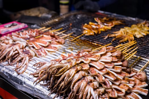 Grill squid sell in the vendor stall in street market