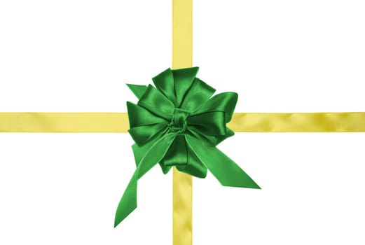 Yellow silk ribbon for cross and green bow, holiday packaging. Top view