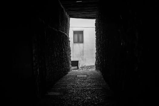 Detail of old gloomy alley in a city