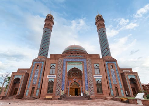 Goy Imam Mosque with its twin minarets and detailed mosaics graces a clear blue sky in Ganja, Azerbaijan
