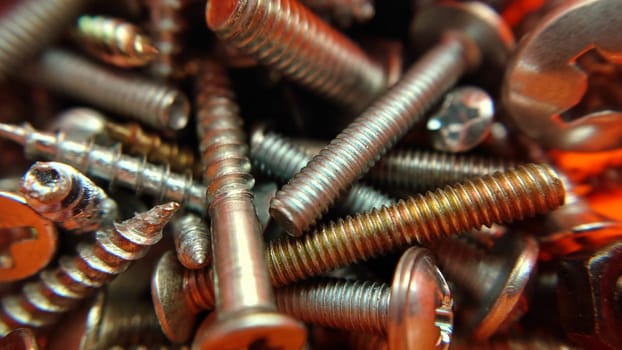 Bolts screws nuts construction fittings close-up.Macrophotography.Texture or background.Selective focus.