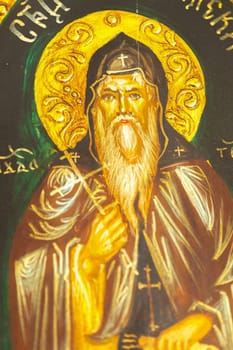 Detail of an icon with the image of an Eastern Orthodox saint.Selective focus with shallow depth of field.