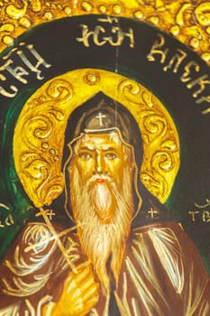 Detail of an icon with the image of an Eastern Orthodox saint.Selective focus with shallow depth of field.