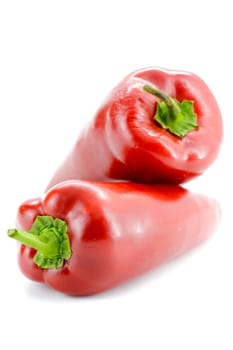 Fresh seasonal peppers on a white background.Selective focus with shallow depth of field.