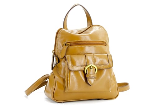 Small brown ladies leather backpack on a white background