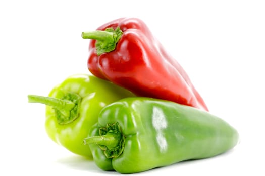 Fresh seasonal peppers on a white background.Selective focus with shallow depth of field.