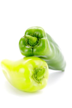 Fresh seasonal peppers on a white background.Selective focus with shallow depth of field.