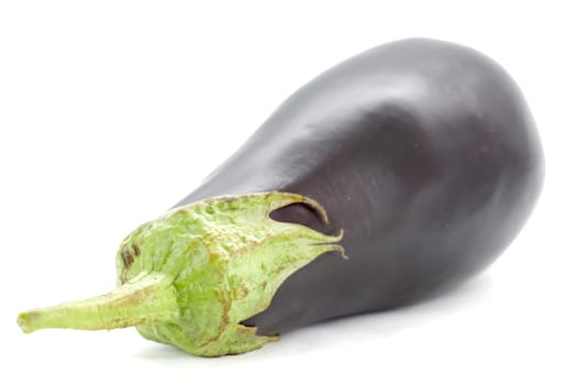 Fresh seasonal eggplant on a white background.Selective focus with shallow depth of field.