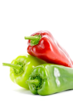 Fresh seasonal peppers on a white background.Selective focus with shallow depth of field.
