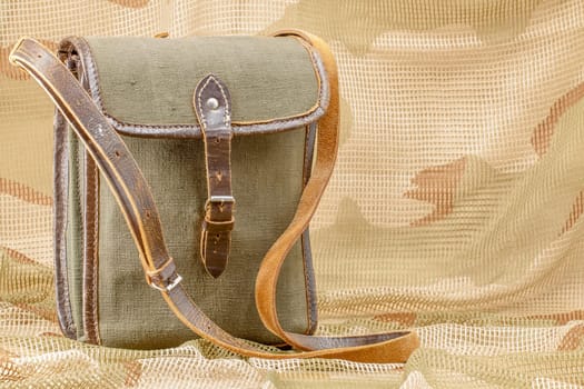 Old vintage canvas bag with leather strap