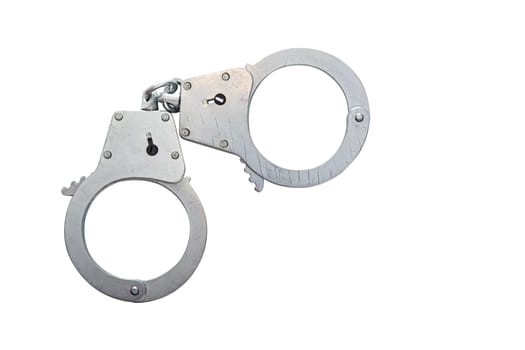 Metal handcuffs on a white isolated background, copy space. High quality photo