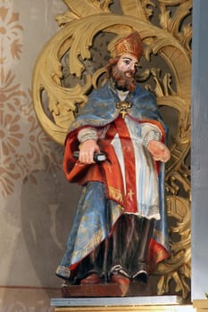 Saint Ambrose, statue on the main altar in the parish church of Saint John the Baptist in Gornji Desinec, Croatia