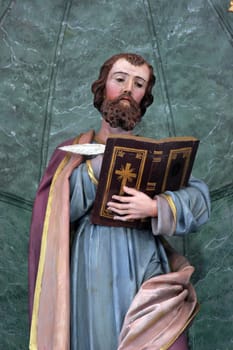 Saint Luke the Evangelist, statue on the High altar in the parish church of Saint Luke in Lukac, Croatia