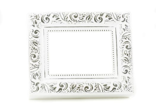 A wooden vintage photo frame has a white background