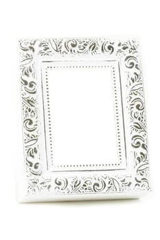 A wooden vintage photo frame has a white background