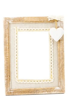 A wooden vintage photo frame has a white background