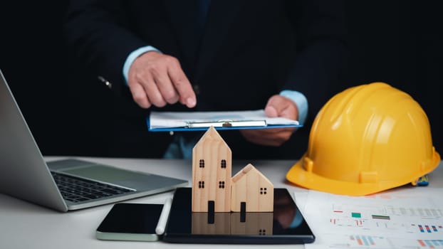 Construction planning, Structural calculation, Construction cost planning, Project presentation plan, Architect or engineer using tablet to work on table, Cost calculation, Structural design.