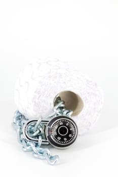 Roll toilet paper locked with padlock and chain on white background