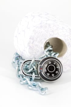 Roll toilet paper locked with padlock and chain on white background