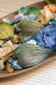 Aromatic dried fruit flowers and leaves on a wooden stand