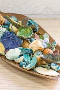 Aromatic dried fruit flowers and leaves on a wooden stand